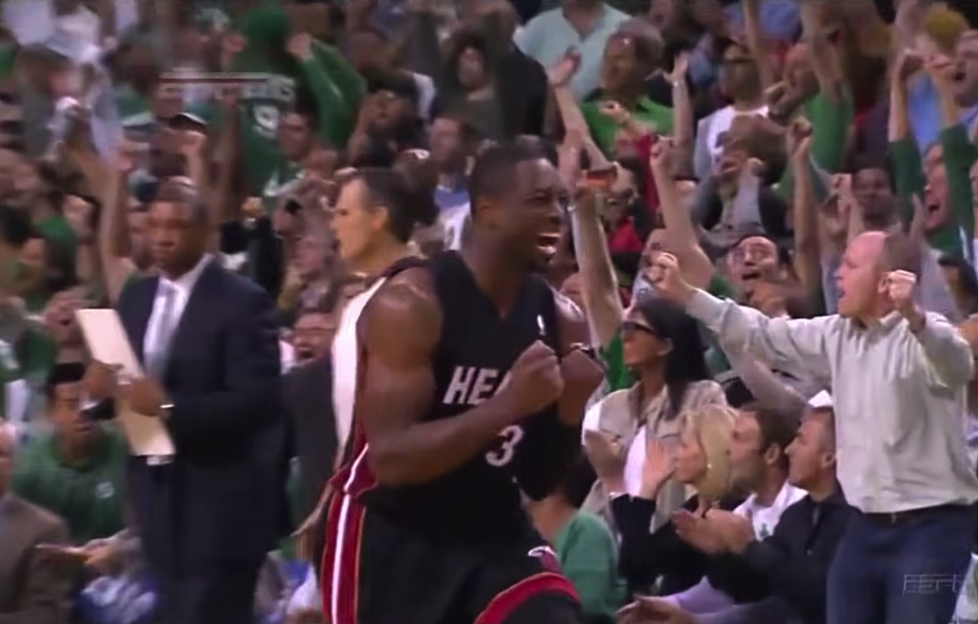 Dwyane Wade reacts after missing a shot against the Boston Celtics