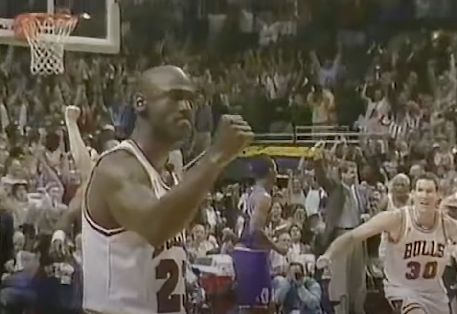 Michael Jordan pumps his fist after making the game winning basket in Game 1 of the 1997 NBA Finals.